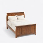 High angled view of a Craftsman panel bed, looking down on the four-panel ends, plain side rails and square legs.