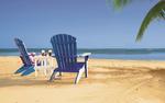 Amish Blue Poly Adirondack Chairs lounging at the beach under a palm tree