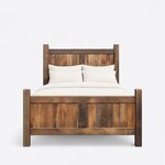 Front view of a farmhouse panel bed, showing a tall planked two-panel headboard and a shorter matching footboard.
