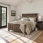 Diagonal angled room view showing the left side of a farmhouse panel bed with square posts, in a white shiplap bedroom.