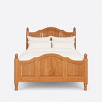 Front view of a traditional panel bed, showing arched crests over three raised panels at each end and acorn finials.