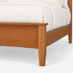 Footboard close-up of a Shaker panel bed, showing the overhanging cap rail, a tapered square leg and the side rail joint.