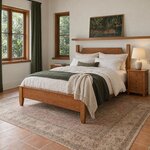 Diagonal angled room view showing the left side of a Shaker panel bed with tall head posts, in a white tropical bedroom.