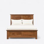 Front view of a platform storage bed, showing a tall two-panel headboard and a low two-panel footboard with overhanging caps.