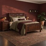 Diagonal angled room view showing the right side of a traditional panel bed with rope molding, in a burgundy bedroom.