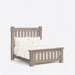 Diagonal angled view showing the right side of a rustic slat bed, with pegged through-tenons and a capped slatted footboard.