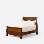 Diagonal angled view showing the left side of a traditional sleigh bed, with a rolled headboard and an S-curved footboard.