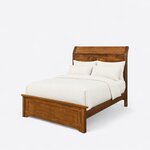 Diagonal angled view showing the left side of a transitional panel bed, with a curved sleigh headboard and a low footboard.