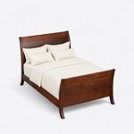 High angled view of a modern sleigh bed, looking down on the swept-back headboard, plain side rails and high footboard.