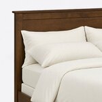 Headboard close-up of a transitional panel bed, showing a flat recessed panel under a narrow top rail and an eased cap.