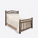 Diagonal angled view showing the right side of a rustic log bed, with an arched fan-spoke headboard and a spindle footboard.