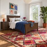 Diagonal angled room view showing the right side of a Mission panel bed with a panel footboard, in a sunlit white bedroom.