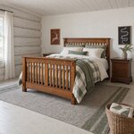 Diagonal angled room view showing the left side of a Mission slat bed with exposed tenons, in a whitewashed cabin bedroom.