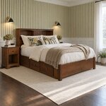 Diagonal angled room view showing the right side of a bookcase storage bed with side drawers, in a green-striped bedroom.