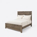 Diagonal angled view showing the left side of a contemporary panel bed, with a tall headboard and a low panel footboard.
