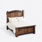 High angled view of a Mission panel bed, looking down on the arched headboard, deep side rails and capped plank footboard.