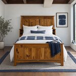Front room view of a Mission bookcase bed with a tall plank headboard and shelf cubbies, in a white bedroom with framed art.