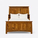 Front view of a Mission bookcase bed, showing a tall plank headboard over shelf cubbies and an arched-apron panel footboard.