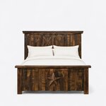 Front view of a rustic panel bed, showing a tall plank headboard with X-braced barn doors over a footboard with a star.