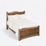 High angled view of a live edge panel bed, looking down on the crowned headboard, side rails and strapped slab footboard.