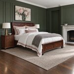 Diagonal angled room view showing the right side of a classic storage bed with footboard drawers, in a green-paneled room.
