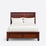 Front view of a classic storage bed, showing a tall three-panel headboard and two footboard drawers on bun feet.