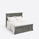 High angled view of a transitional panel bed, looking down on the stepped caps and the paneled footboard on bracket feet.