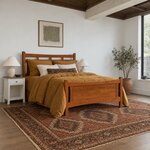 Angled room view of a transitional panel bed in a reddish-brown finish, in a white bedroom with a coffered ceiling.