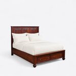 Diagonal angled view showing the right side of a traditional storage bed, with a three-panel headboard and footboard drawers.