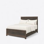 Diagonal angled view showing the left side of a rustic panel bed, with a framed panel headboard and low panel footboard.