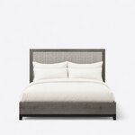 Front view of a modern upholstered bed, showing a tall wood-framed headboard and a low boxed footboard on short square legs.