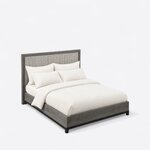 High angled view of a modern upholstered bed, looking down on the framed headboard and boxed platform base on short legs.