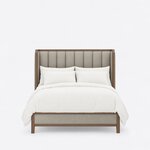 Front view of a modern upholstered bed, showing a tall channel-tufted wingback headboard and a low upholstered footboard.