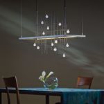 Hubbardton Forge Spring LED Pendant Hung over Table