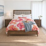 Front room view of a contemporary upholstered bed with a button-tufted headboard, in a white coastal bedroom.