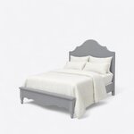 Diagonal angled view showing the left side of a farmhouse panel bed, with a scalloped plank headboard and turned bun feet.