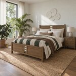 Diagonal angled room view showing the left side of a modern panel bed with a cutout footboard, in a plant-filled bedroom.
