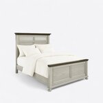 Diagonal angled view showing the right side of a coastal panel bed, with a louvered headboard, panel footboard and bun feet.
