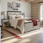 Diagonal angled room view showing the right side of a coastal panel bed with a louvered headboard, in a log cabin bedroom.