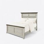Diagonal angled view showing the left side of a coastal panel bed, with a louvered headboard, panel footboard and bun feet.