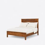 Diagonal angled view showing the left side of a transitional panel bed, with a plank headboard and a low capped footboard.