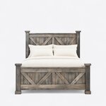 Front view of a rustic panel bed, showing a tall V-braced headboard and a lower matching footboard on capped square posts.