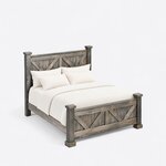 High angled view of a rustic panel bed, looking down on the V-braced footboard, side rails and block feet on the foot posts.