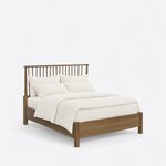 Diagonal angled view showing the right side of a Windsor spindle bed, with a spindle headboard and a low solid footboard.