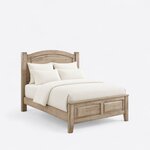 Diagonal angled view showing the right side of a traditional panel bed, with an arched headboard and a two-panel footboard.