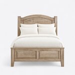 Front view of a traditional panel bed, showing an arched raised-panel headboard and a two-panel footboard on tapered legs.