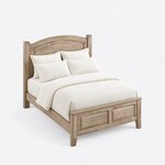 High angled view of a traditional panel bed, looking down on the arched headboard, side rails and two-panel footboard.