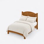 High angled view of a transitional panel bed, looking down on the arched headboard and the footboard's arched apron.