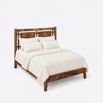 High angled view of a farmhouse panel bed, looking down on the open-panel headboard, side rails and low footboard.