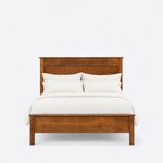 Front view of a farmhouse panel bed, showing a tall stacked-panel headboard and a low footboard on square legs.
